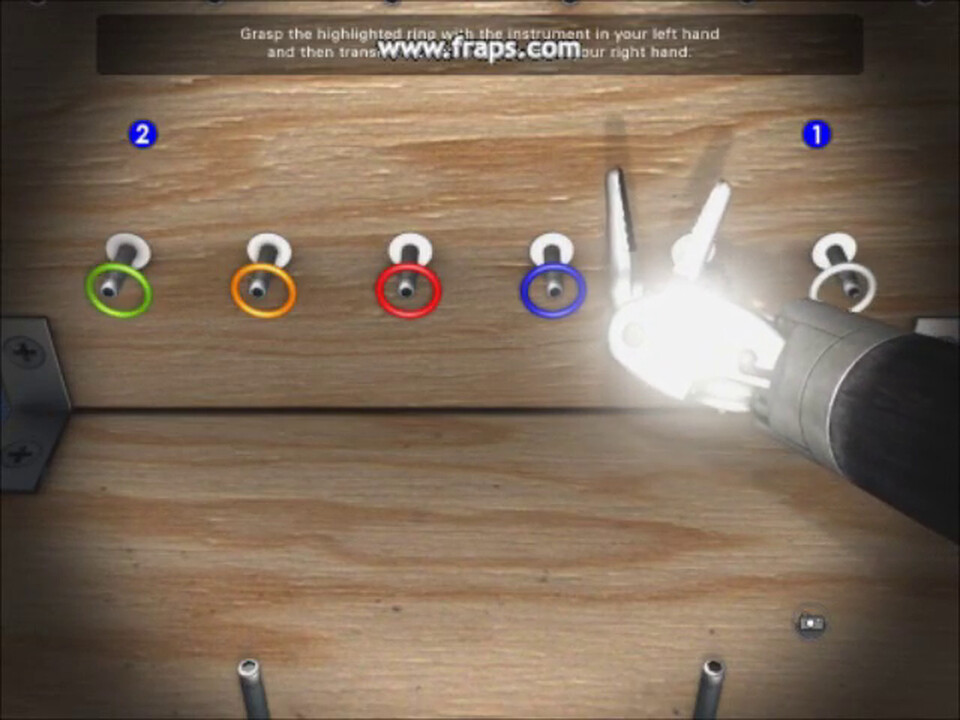 Video: an instrument near the camera blooming in the endoscope light in front of a pegboard