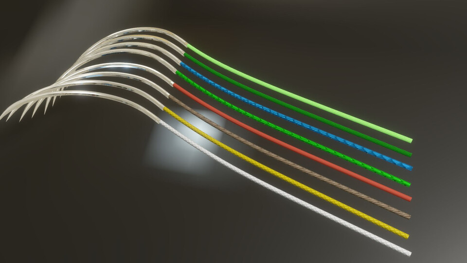 Curved suture needles with colored threads under a spotlight on a dark background